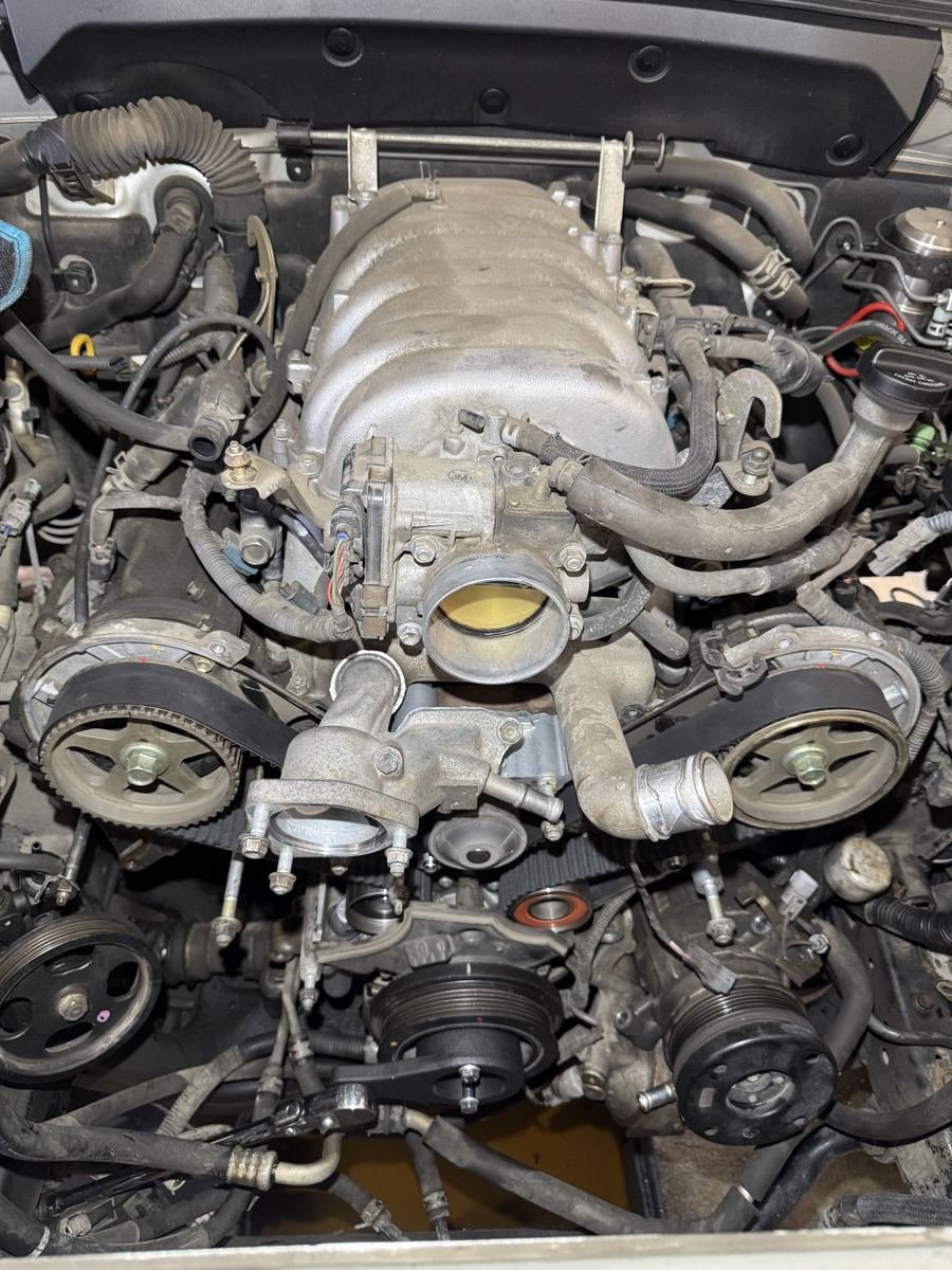 V8 engine with the intake exposed during a repair