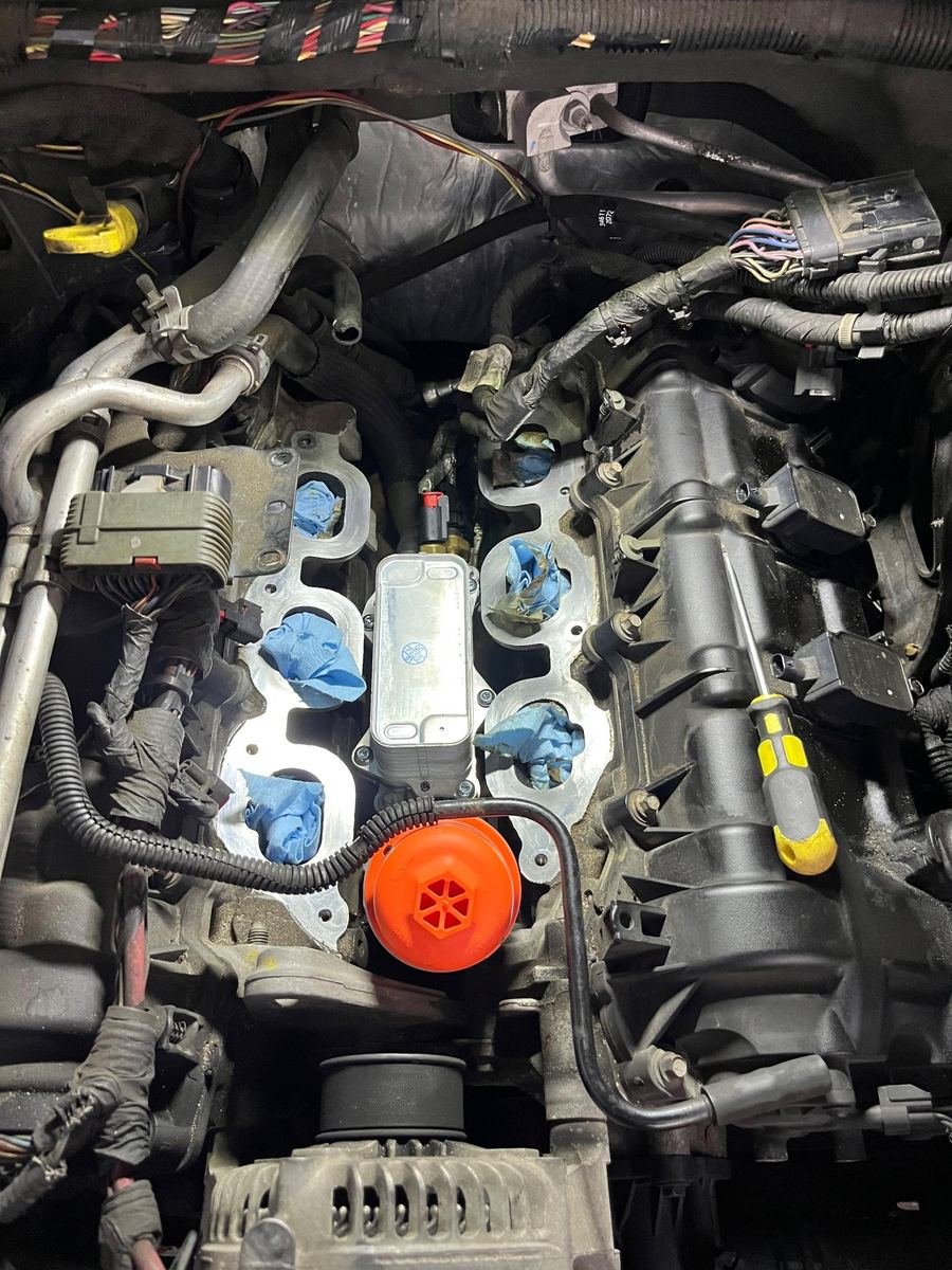 Engine with ignition coils removed during a tune-up